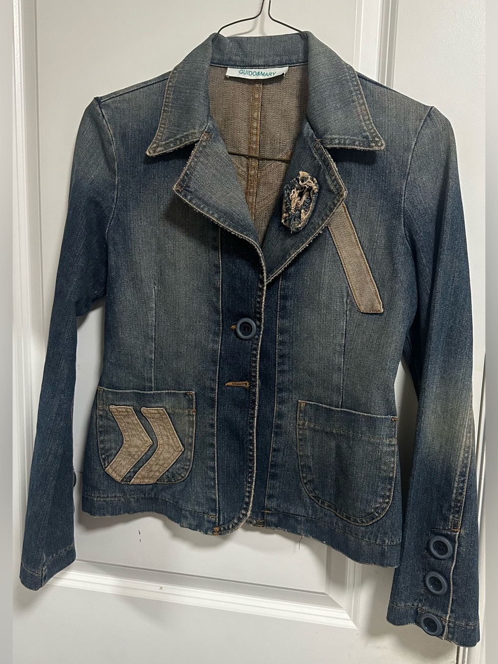 Women's Faded Blue Denim Jacket with Decorative Patch